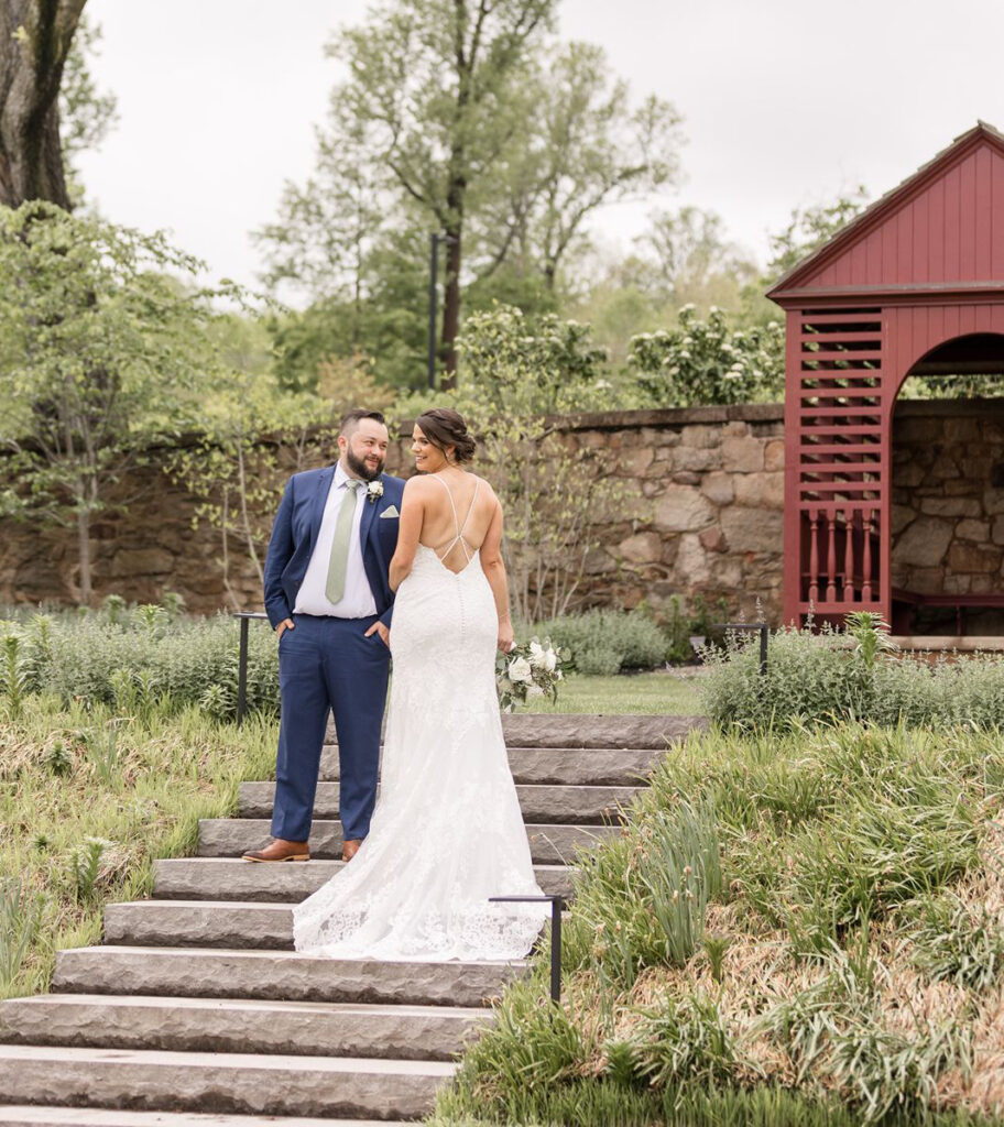 bride and groom first look at outdoor wedding venue in pa